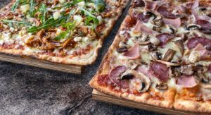 Pizza slice on a plate.